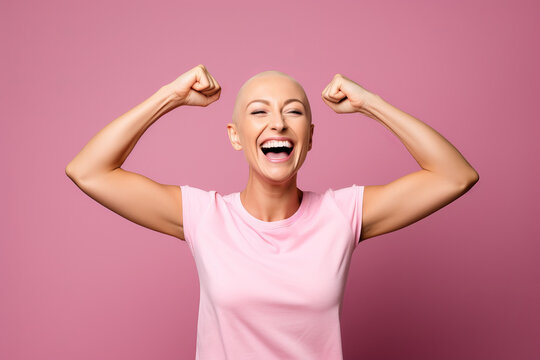 Studio portrait of a happy cancer patient against a pink background