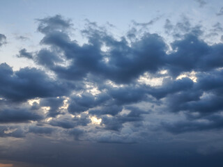 Fototapeta na wymiar Dark storm clouds stretching towards the horizon