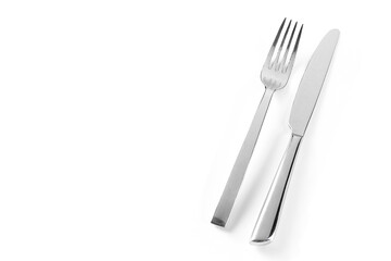 Knife and fork isolated on white background. Elegant shiny cutlery set