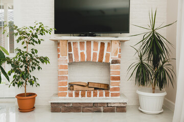 homemade red brick fireplace in the living room.
