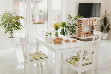 Luxurious home interior with living room next to kitchen and glass door facing outside