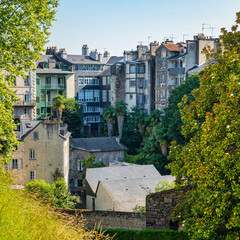 Buildings with picturesque facades by the river in the medieval city of Pau, France.
