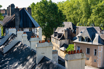 Colorful old buildings with black slate roofs in the monumental city of Pau, France.