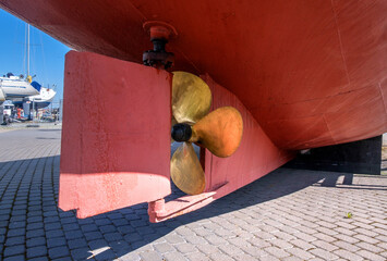 Propeller of a ship. The lower part of the ship's stern with propeller and keel. The ship is on...