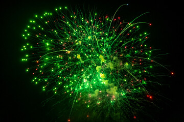 Beautiful green fireworks at night. Selective focus. 