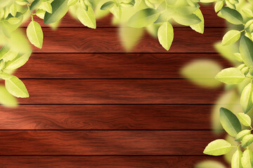 Wooden background with green leaves and copy space for your text.