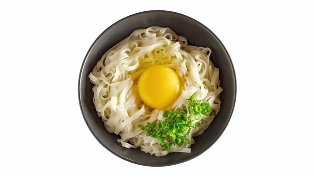 Udon noodles with raw egg and chopped green onion, japanese ingredients, rotating on white background, turning, looped video

