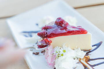 Appetizing white blueberry cake in a cafe next to the sea, Sue Flamingo, Ao Yon Beach, Phuket Thailand