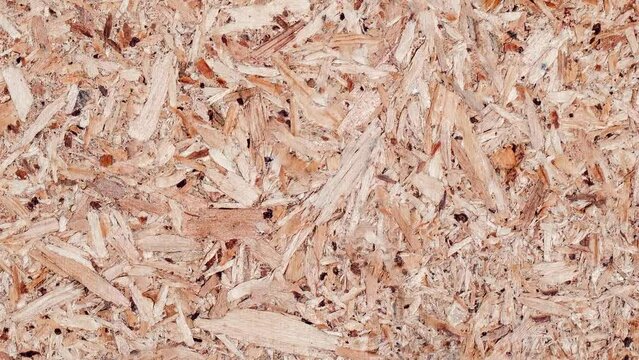 Wood chipboard wooden, rotating, turning, close-up, looped video

