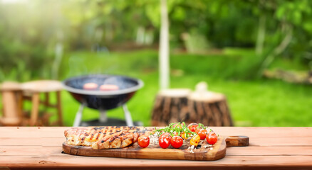 delicious bbq lunch on top of a table with a park background