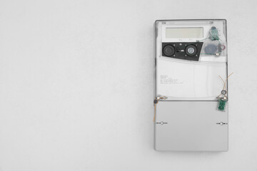 Electric meter on white background, top view with space for text. Measuring device