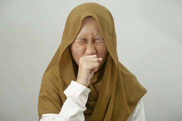 Asian muslim teenage girl wearing hijab cough, respiratory health problem, medical disease health...