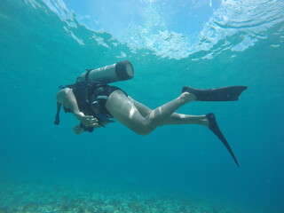 tourist diving in the caribbean sea
