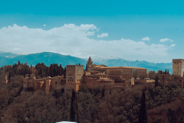 Fototapeta na wymiar Granada,Spain. April 14, 2022: Alhambra castle panoramic landscape with blue sky.