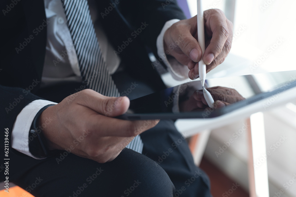 Poster businessman using stylus pen signing on e-document on digital tablet via mobile app at modern office