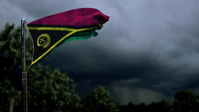 waving Vanuatu flag for state holiday on dark storm clouds