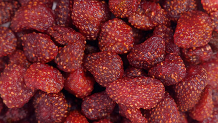 Top view of delicious dried strawberry pieces. Packed with natural sweetness and nutrients. Concept of a delightful and wholesome snack option.