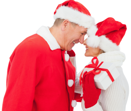 Digital png photo of happy caucasian couple in santa's hat holding gift on transparent background