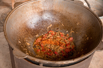 adding chilli to the a curry