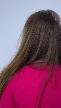 young girl with long straight brown hair Playful girl pointing at camera with finger gun gesture, she is happy cheerful happy woman beautiful positive cute model girl posing indoor, looking at camera