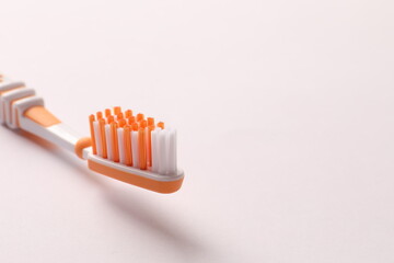 Toothbrush lies on a white background. Dentistry and healthcare concept
