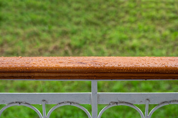 The balcony railing with rain drops. Background for inspiration and creativity, mood board. - Powered by Adobe