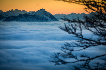 Splendid apline scenery. High mountains with fog and lovely evening light.