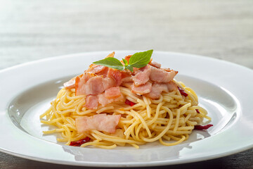 Spaghetti aglio e olio, pasta with chili and garlic and bacon