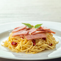 Spaghetti aglio e olio, pasta with chili and garlic and ham