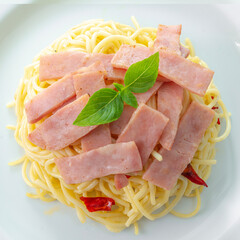 Spaghetti aglio e olio, pasta with chili and garlic and ham