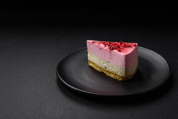 Delicious sweet dessert cheesecake with raspberry and pistachio flavor