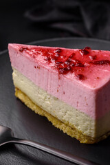 Delicious sweet dessert cheesecake with raspberry and pistachio flavor