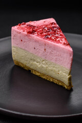 Delicious sweet dessert cheesecake with raspberry and pistachio flavor