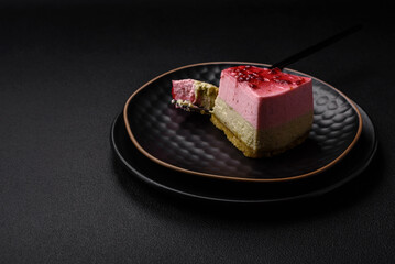 Delicious sweet dessert cheesecake with raspberry and pistachio flavor