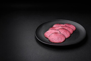 Delicious smoked salami sausage with salt, pepper, spices and herbs