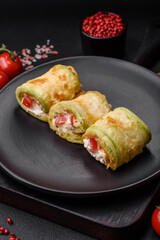 Delicious healthy vegetarian vegetable roll of zucchini, tomatoes, peppers and sauce