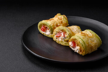 Delicious healthy vegetarian vegetable roll of zucchini, tomatoes, peppers and sauce