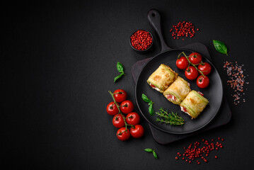 Delicious healthy vegetarian vegetable roll of zucchini, tomatoes, peppers and sauce