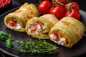 Delicious healthy vegetarian vegetable roll of zucchini, tomatoes, peppers and sauce