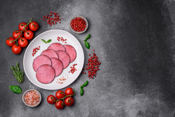 Delicious smoked salami sausage with salt, pepper, spices and herbs