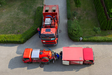 Aerial view, truck vehicles to pipe unclogging and bailer in floods , professional service company.