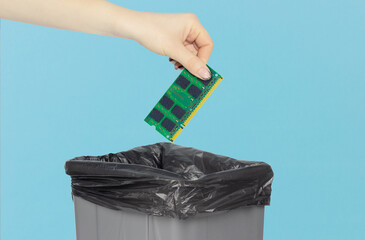 Throw the board in the trash can, SSD board in hand in front of the trash can, the concept of...