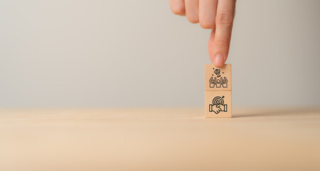 Business success and leadership concept. Teamwork running to goal and achieving successful business.  Common goals, growth performance, market leader icon on wooden cube blocks with grey background.