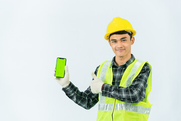 Hand drawn asian male service worker holding a green screen phone smiling confidently with his left hand He wore a brown and black striped shirt and light green coat, yellow hat and cotton gloves.