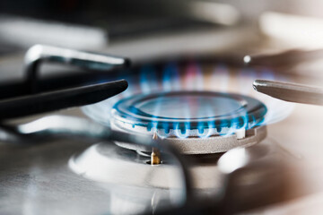 burning gas burner on the stove