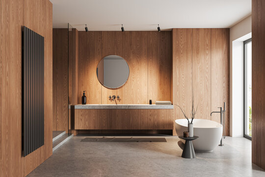 Light wooden bathroom interior with tub and sink