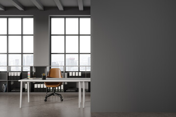 Grey office interior with table and chair, shelf and window. Mock up wall