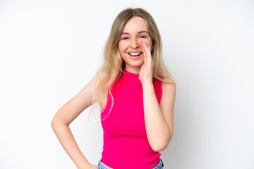 Blonde English young girl isolated on white background shouting with mouth wide open