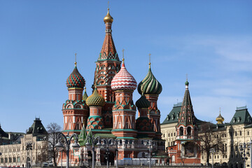 Fototapeta na wymiar Cupolas of St. Basil's Cathedral on Red Square in Moscow Russia against blue cloudless sky