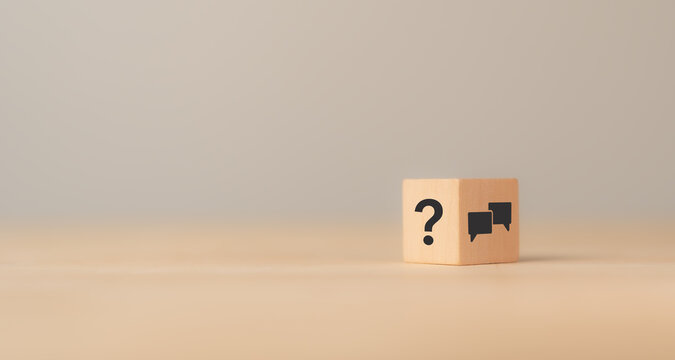 Q and A concept. Q and A symbols on wooden cube block on a grey background. Illustration for frequently asked questions concepts in websites, social networks, business issues. Recommendation concept.